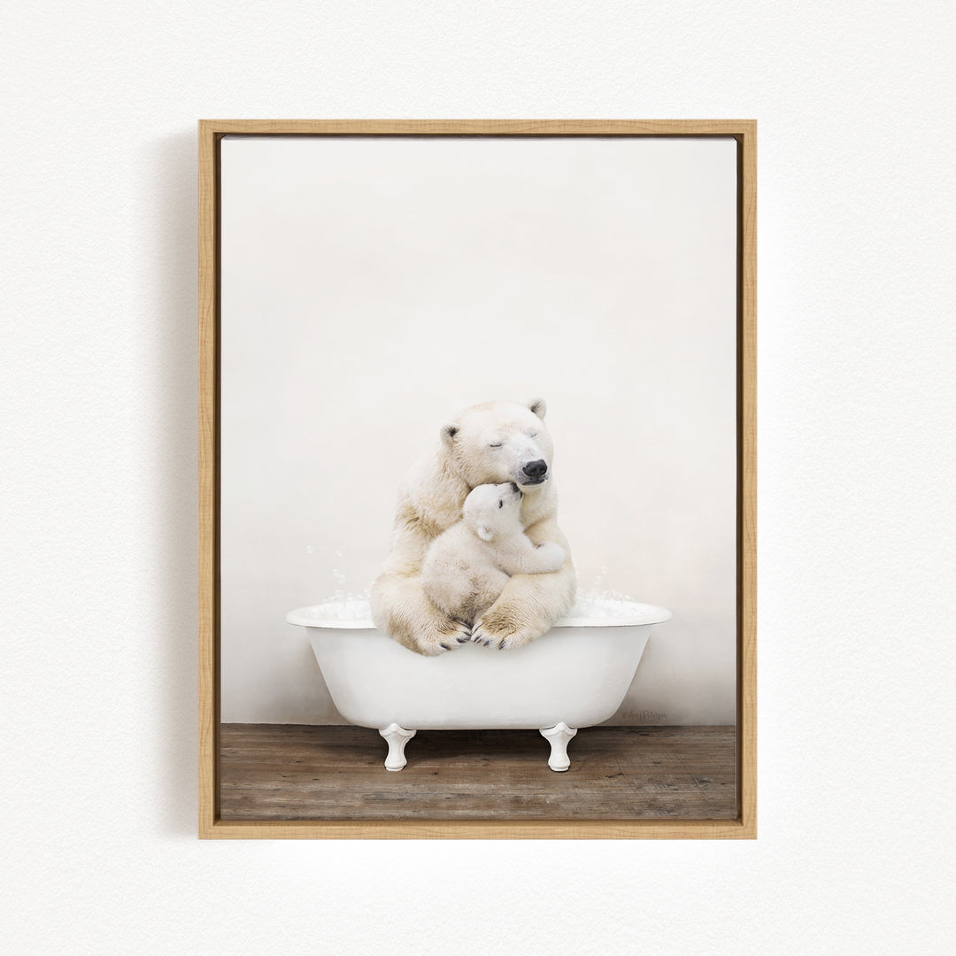 A mother polar bear and her cub sitting together in a white bathtub, with the mother appearing to be comforting her cub.