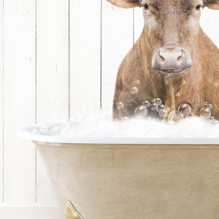 a cow is sitting in a bathtub with bubbles