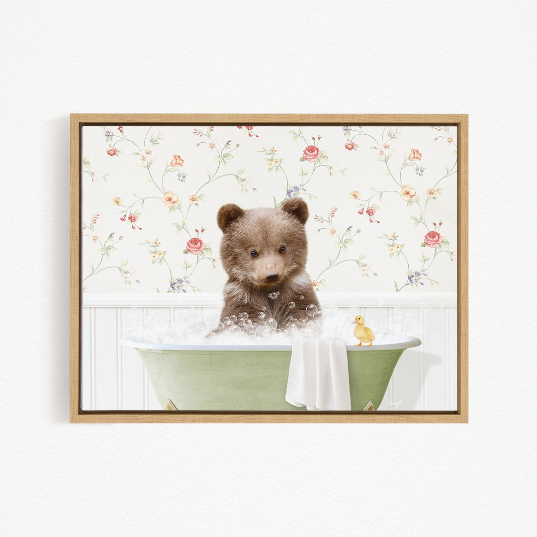 A cute brown bear sitting in a green bathtub filled with bubbles, with a yellow rubber duck floating nearby.
