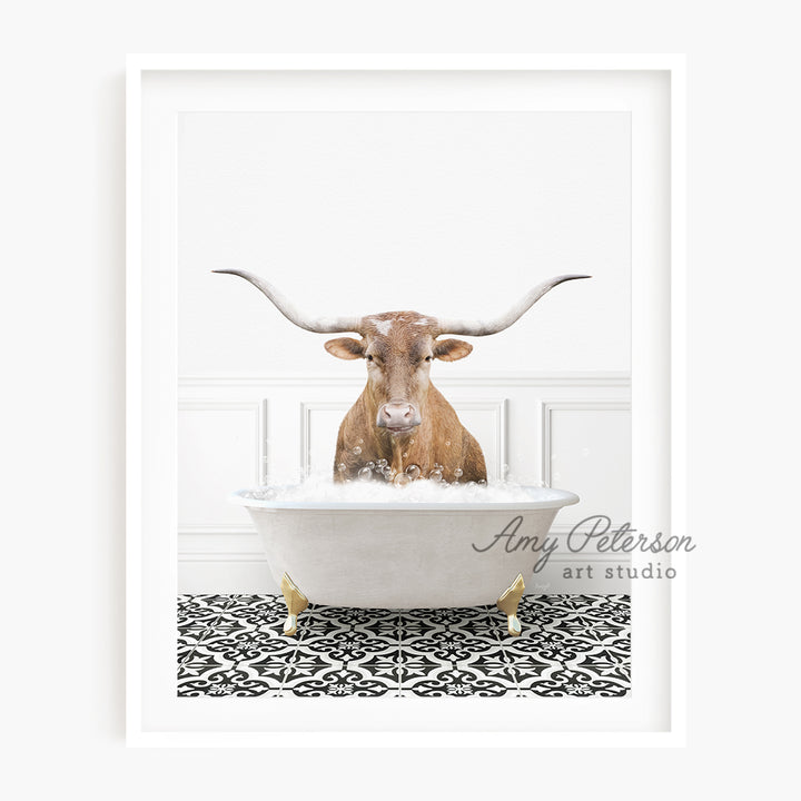 a cow with long horns sitting in a bathtub