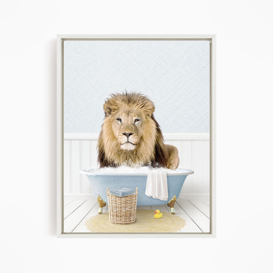 A lion sitting in a blue bathtub filled with water, surrounded by a yellow rubber duck and a basket.
