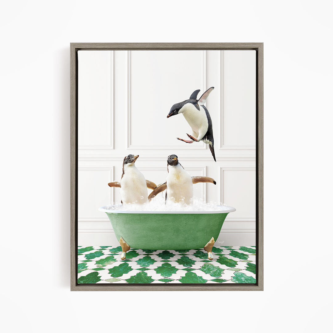 A framed image depicting two penguins sitting in a green bathtub, with one penguin flying towards the other in mid-air.