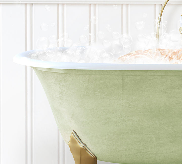 a bathtub filled with bubbles and a gold faucet