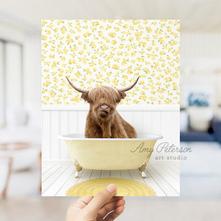 a hand holding up a card with a picture of a cow in a bathtub