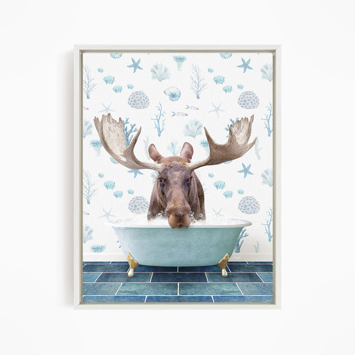 A moose with large antlers is sitting in a blue bathtub, surrounded by a pattern of seashells and starfish.
