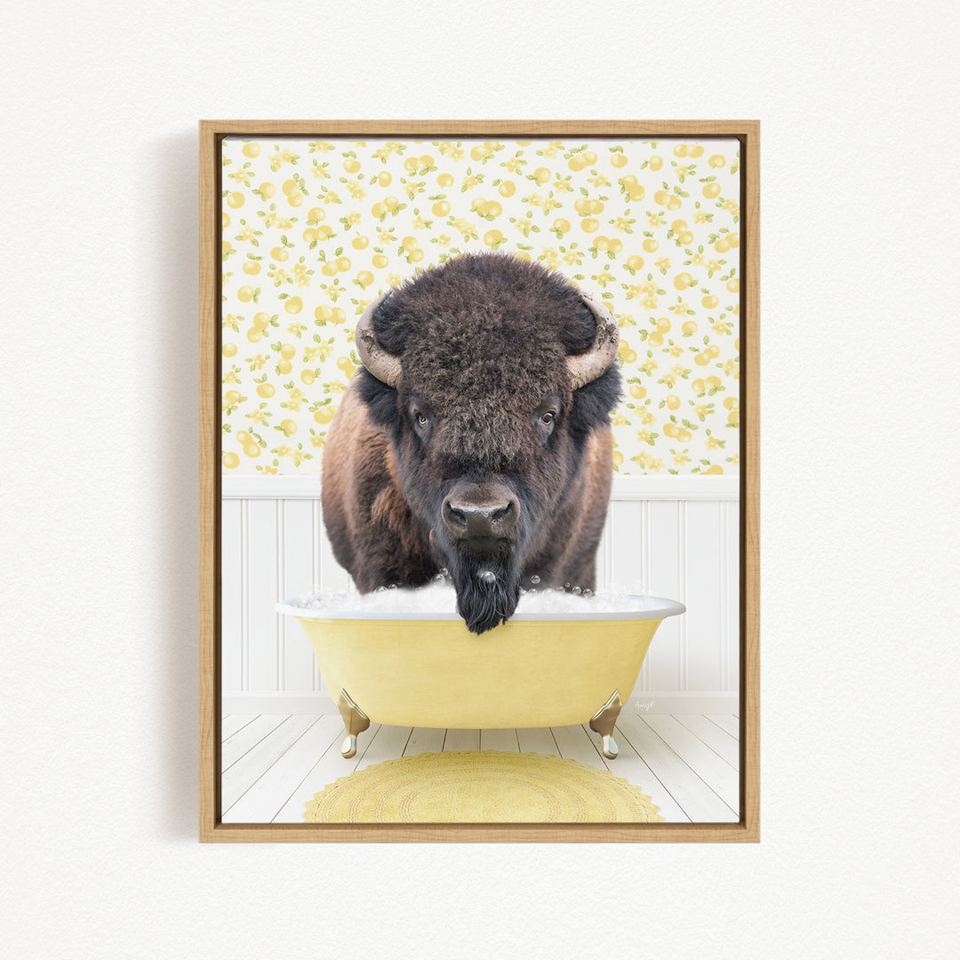 A buffalo with a long beard is sitting in a yellow bathtub, looking directly at the camera.