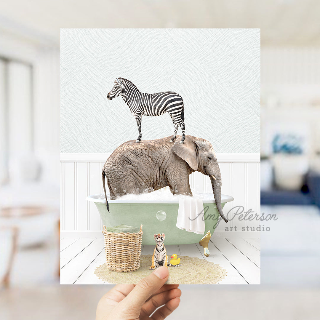 a person holding up a card with a picture of an elephant and a zebra on