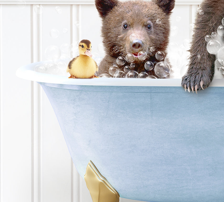 a bear and a rubber duck in a bathtub