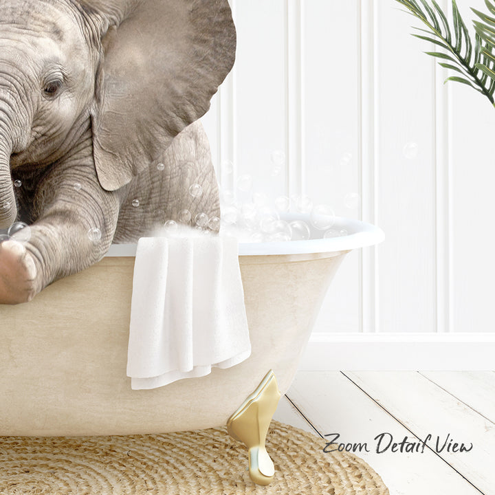 A baby elephant sitting in a bathtub filled with bubbles, surrounded by a towel and a plant.