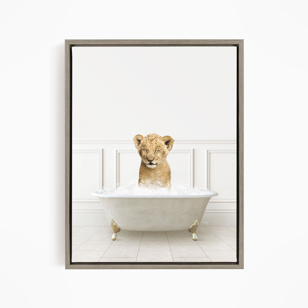 A young lion cub sitting in a white bathtub filled with water, looking at the camera with its eyes closed.