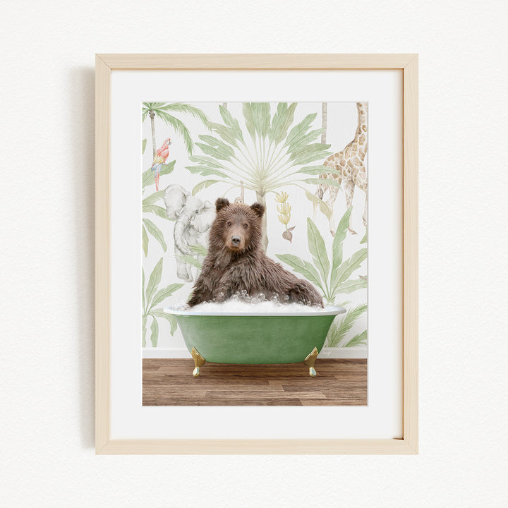 A brown bear is sitting in a green bathtub, surrounded by a tropical wallpaper with various animals and plants.