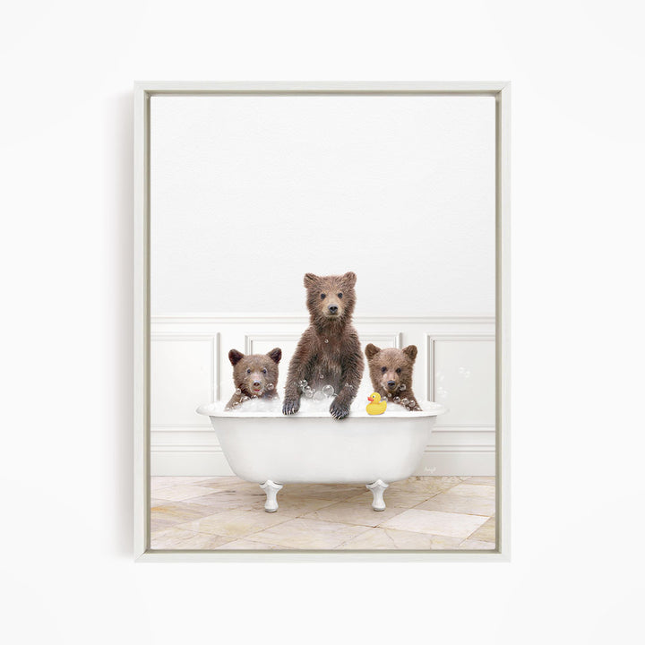 A family of three bears enjoying a bath in a white bathtub, with a rubber duck floating in the water.