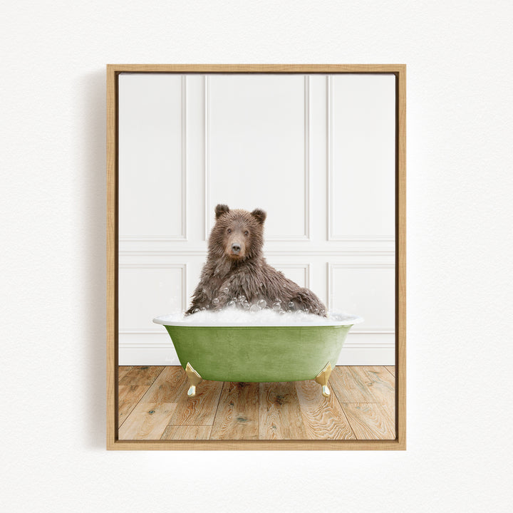 A brown bear sitting in a green bathtub filled with water, with a white wall and wooden floor in the background.