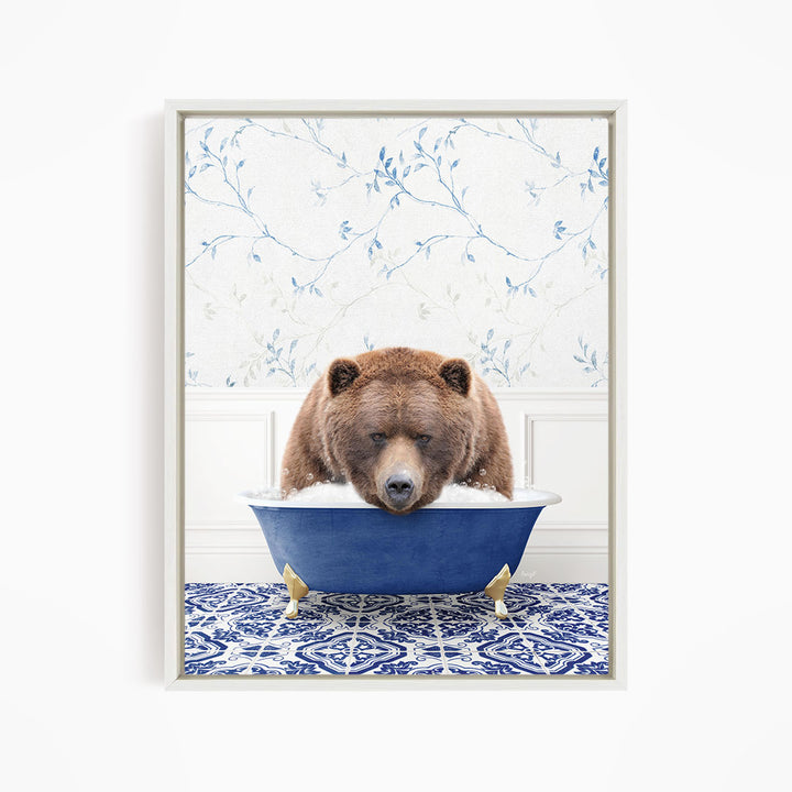 A brown bear is sitting in a blue bathtub, appearing to be enjoying a relaxing bath.