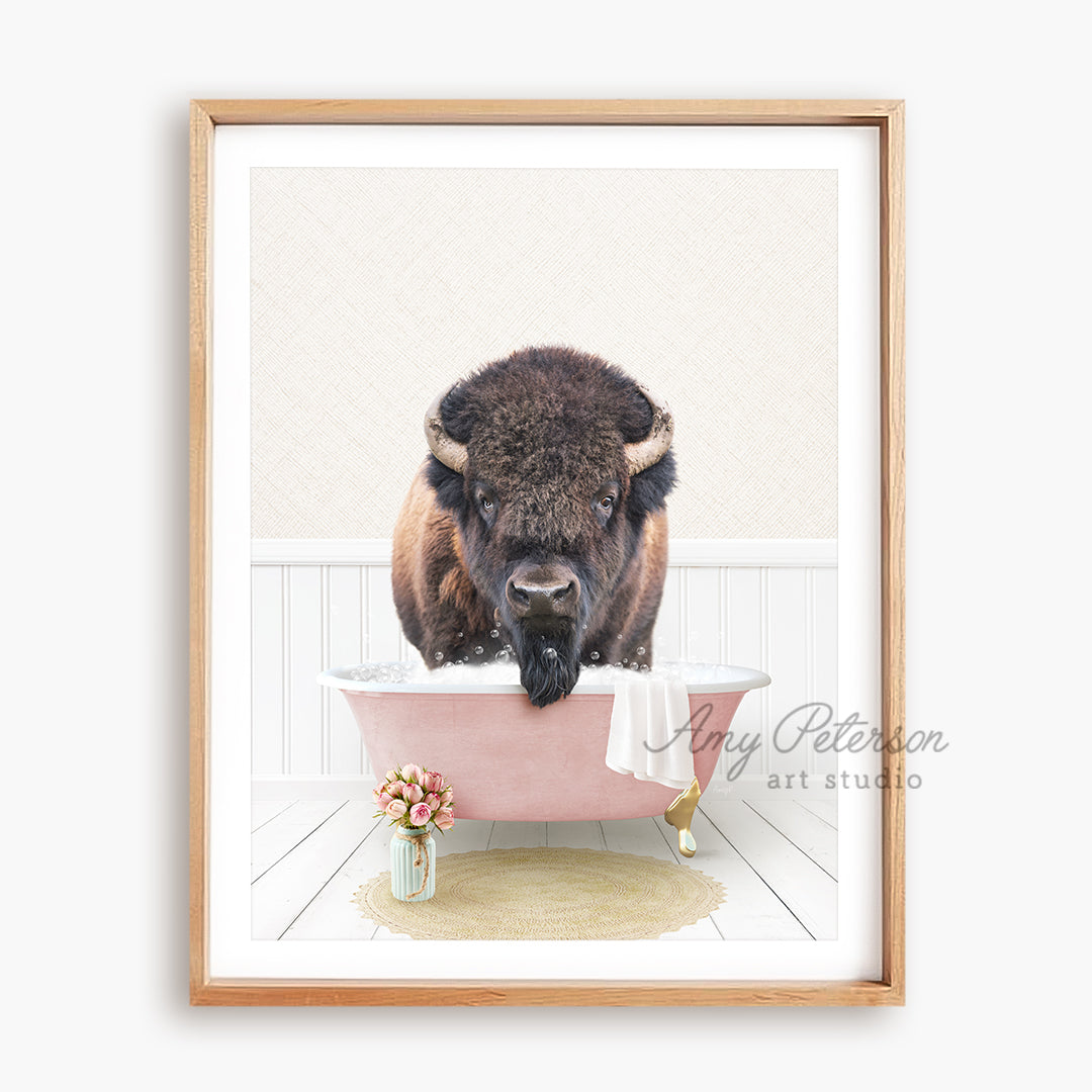 a picture of a bison taking a bath in a pink bathtub