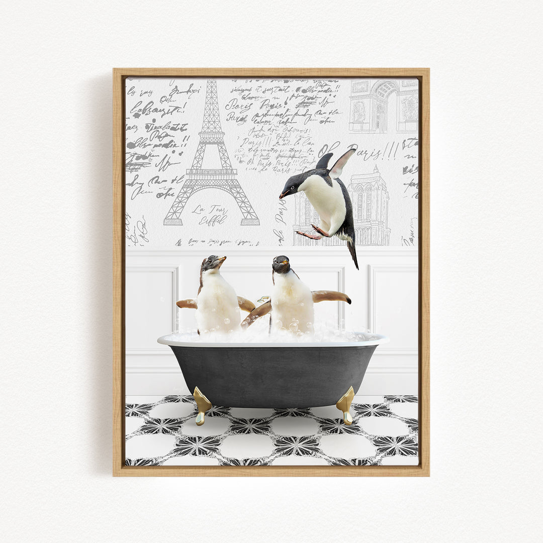 A framed image depicting three penguins sitting in a bathtub, with one penguin flying towards the others.