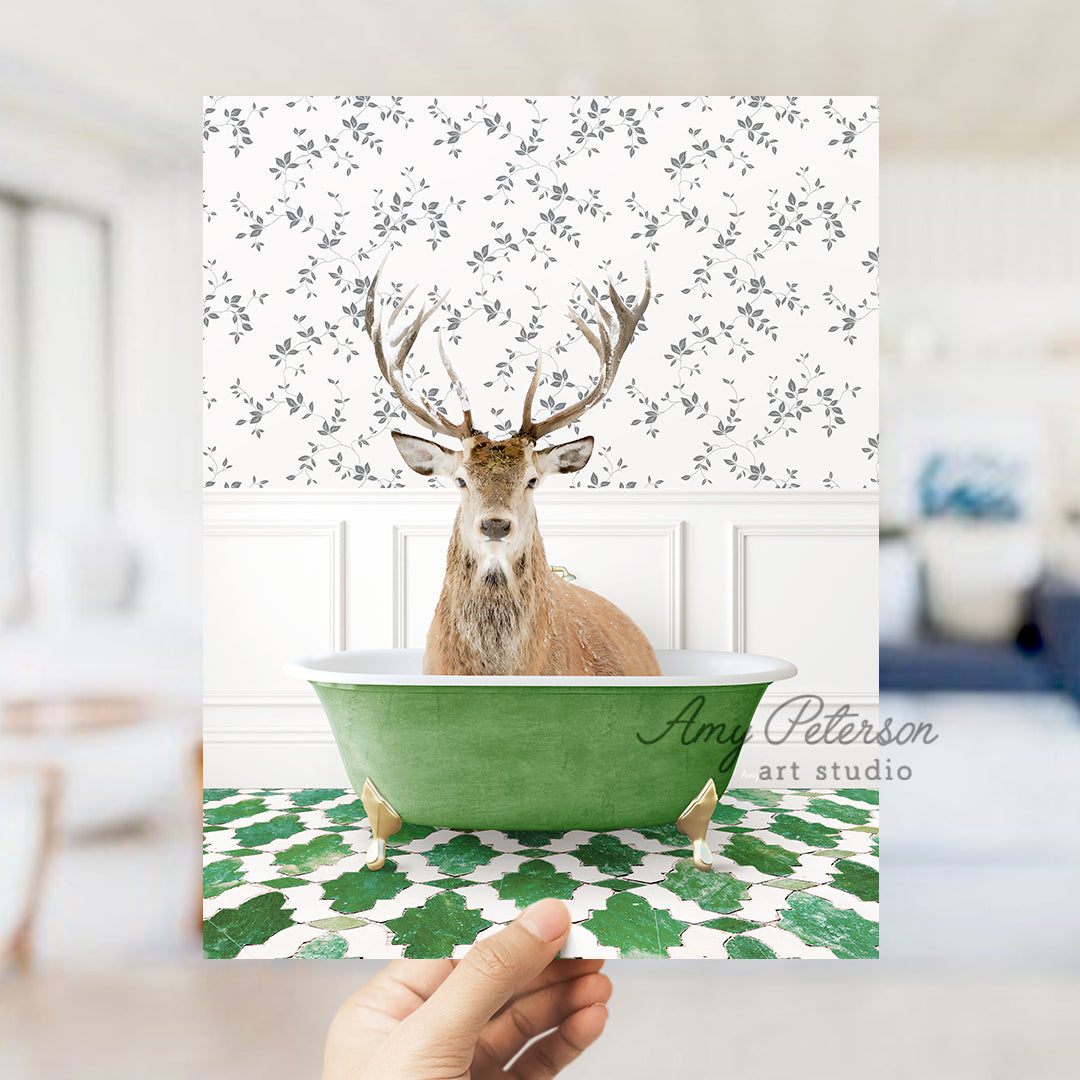 a hand holding up a card with a picture of a deer in a bathtub