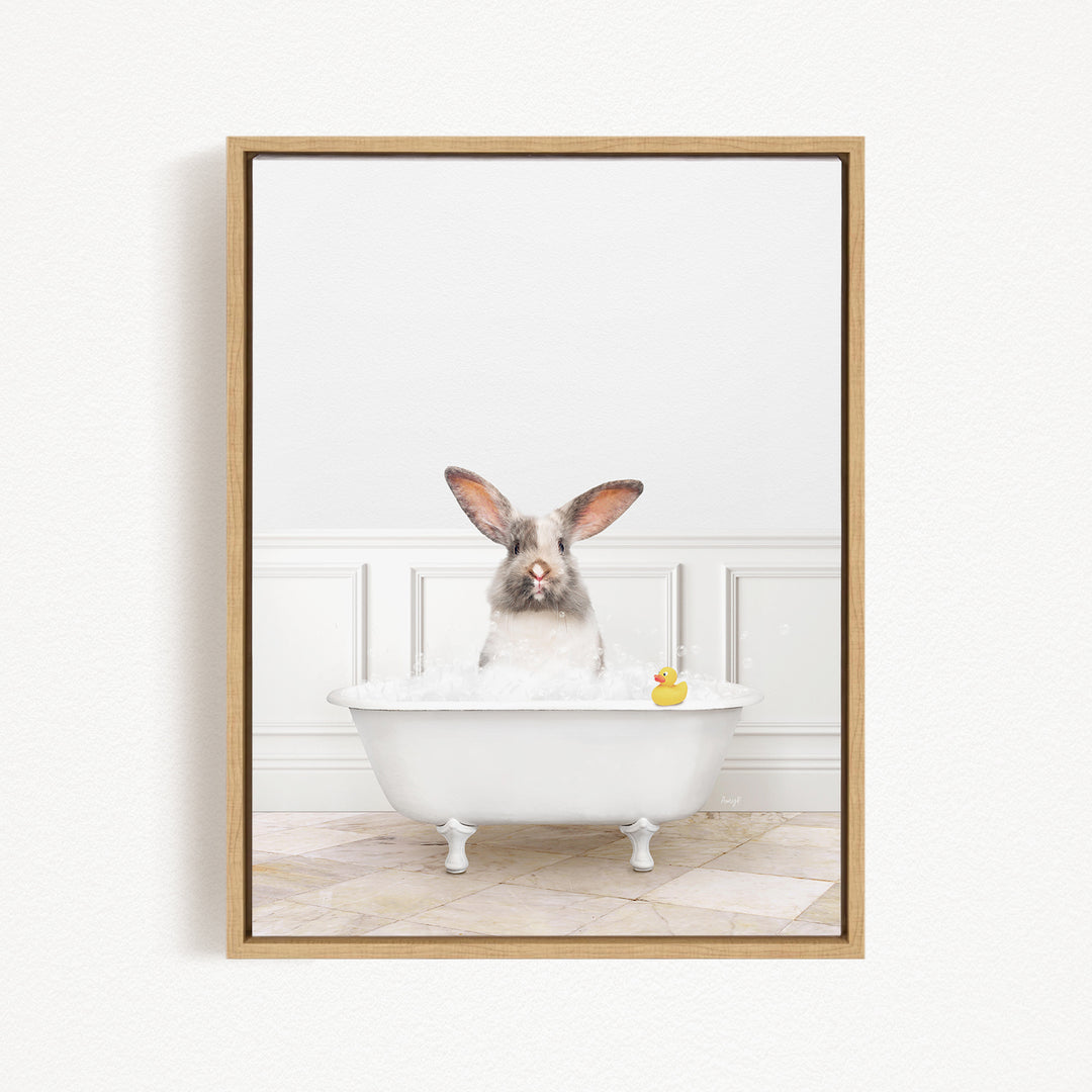 A white rabbit sitting in a white bathtub, with a yellow rubber duck floating in the water.