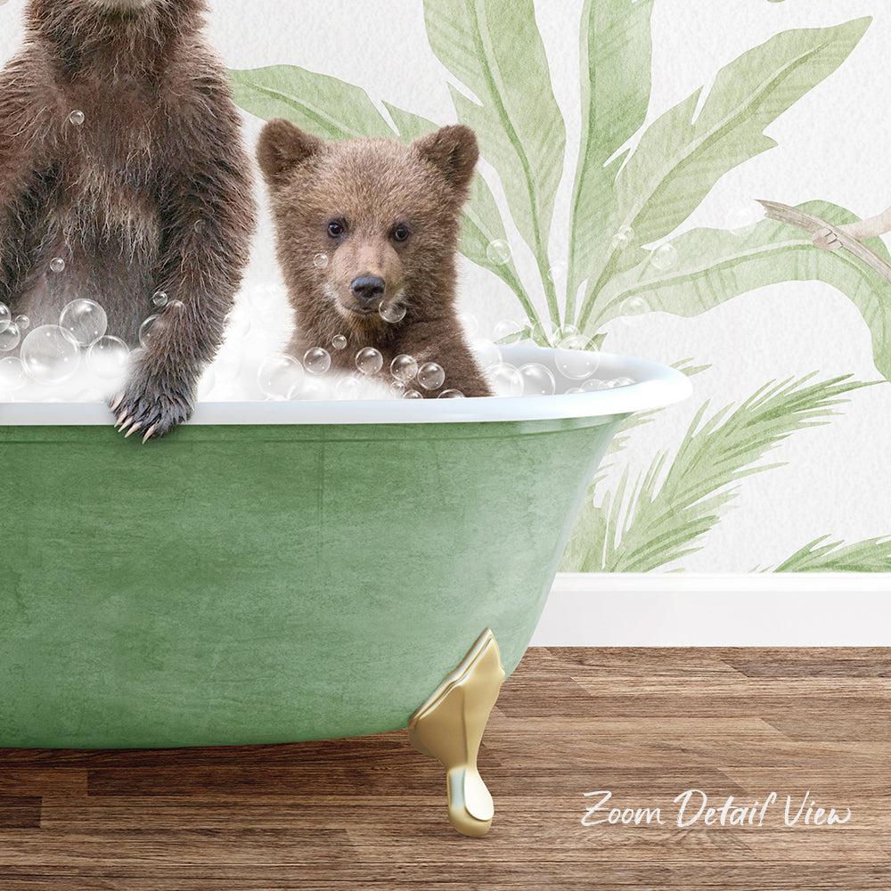 A baby bear sitting in a green bathtub, surrounded by bubbles, with a palm tree mural in the background.