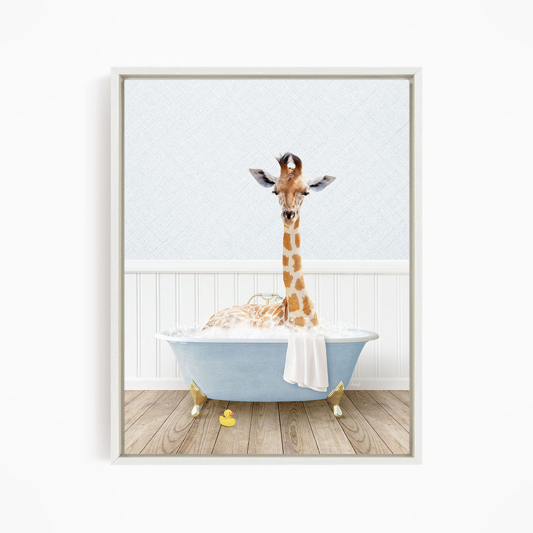 A giraffe is sitting in a blue bathtub filled with water, surrounded by a white wall and wooden floor.