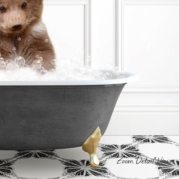A brown bear is sitting in a bathtub filled with bubbles, with a black and white patterned floor in the foreground.
