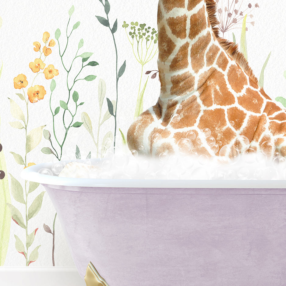 a giraffe sitting in a bathtub with flowers on the wall