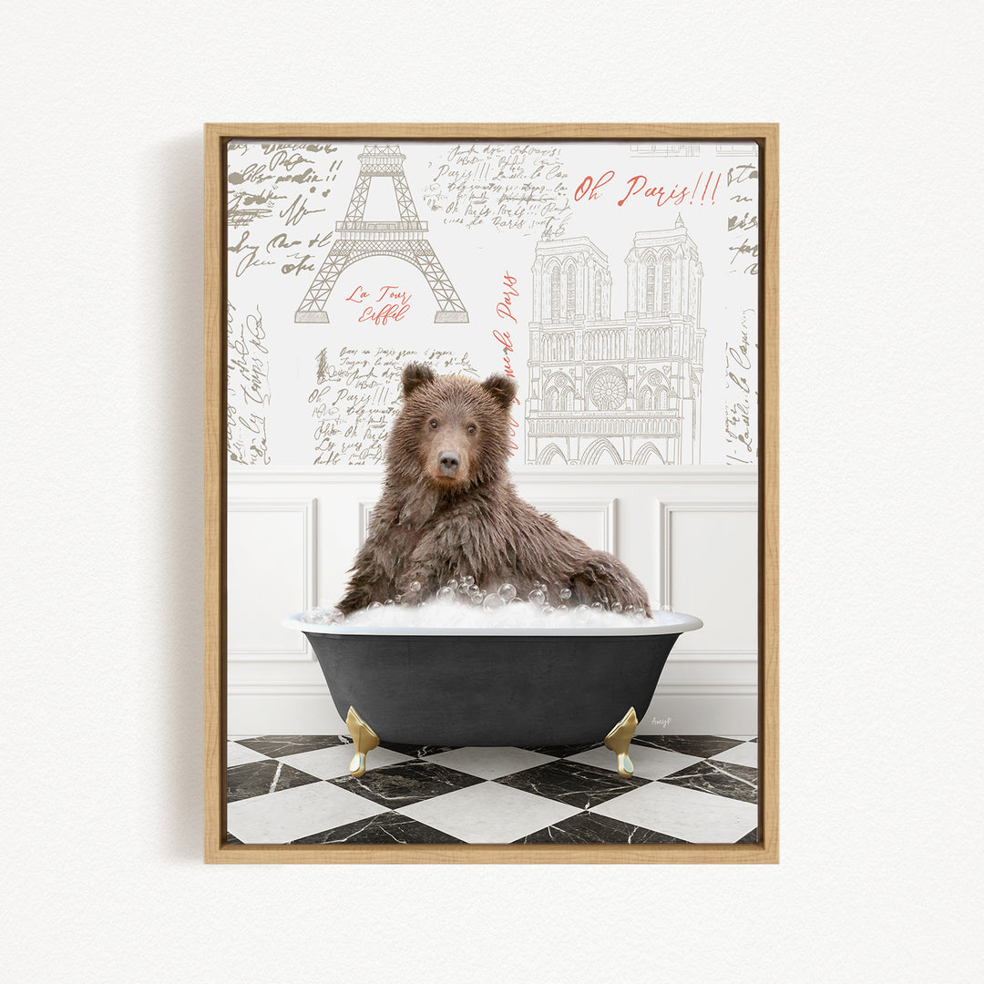 A brown bear sitting in a bathtub filled with bubbles, with a Paris-themed background featuring the Eiffel Tower and other landmarks.
