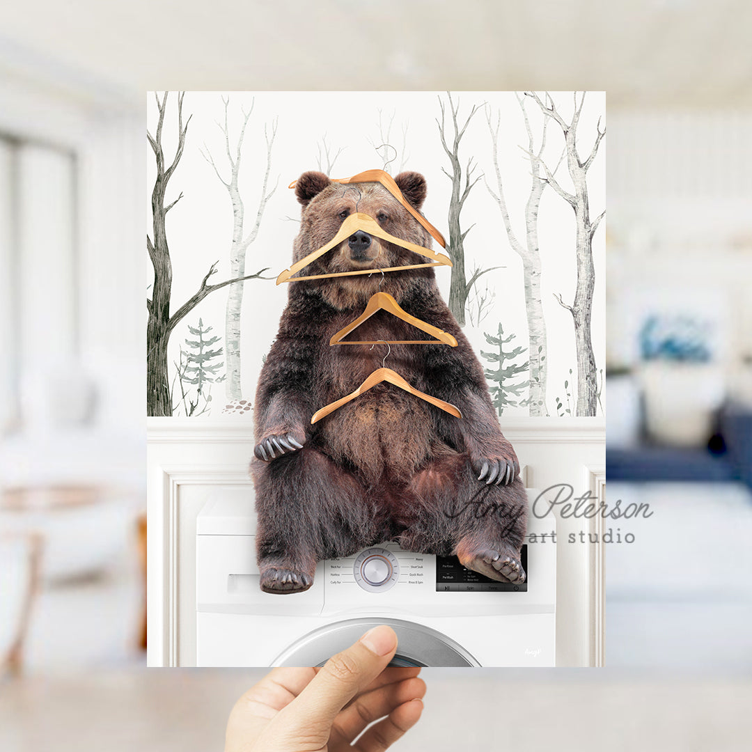 a person holding up a card with a bear on it