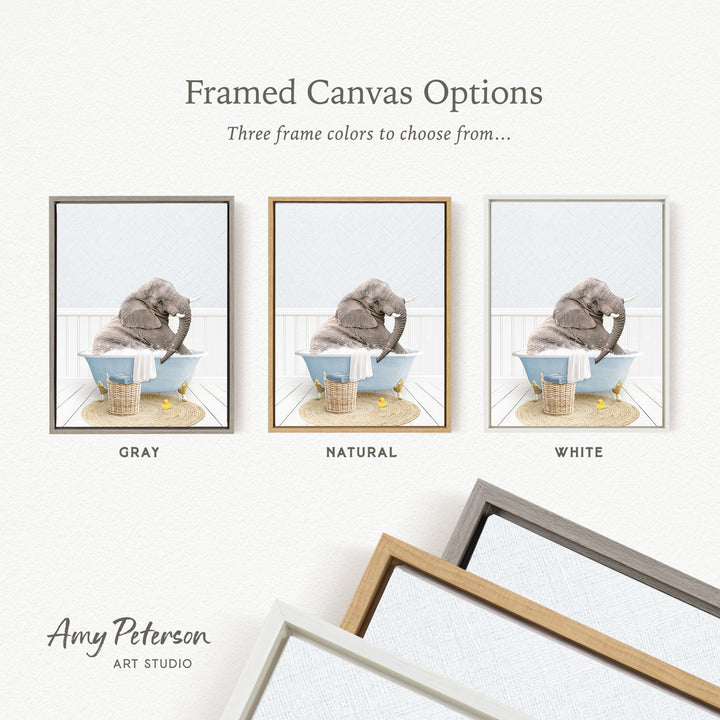 The image is a framed canvas option showcasing three different frame colors: gray, natural, and white. The canvas features a gray elephant sitting in a bathtub, with a basket nearby.