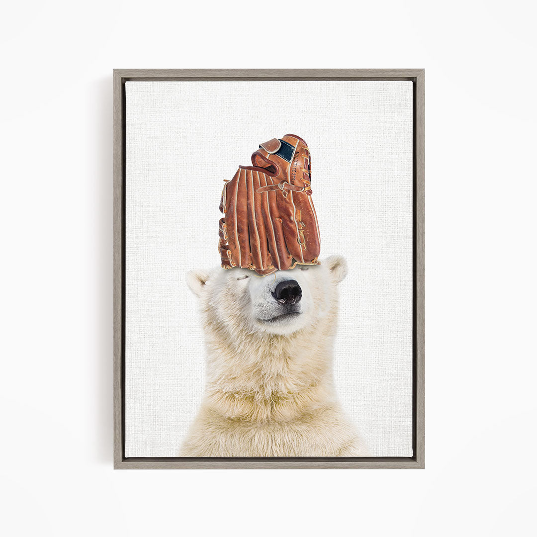 A polar bear wearing a baseball glove on its head.