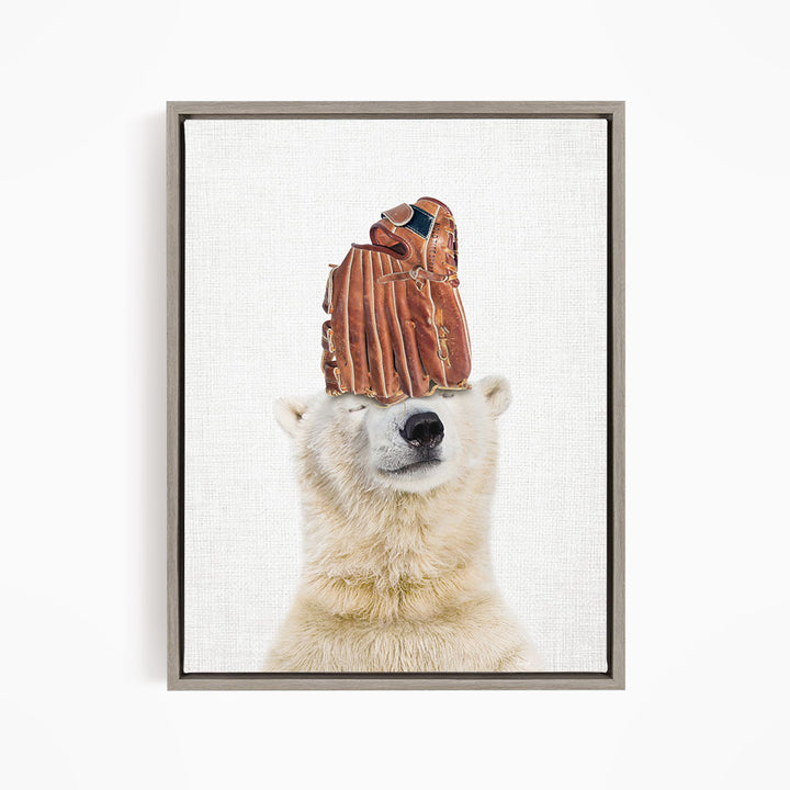 A polar bear wearing a baseball glove on its head.