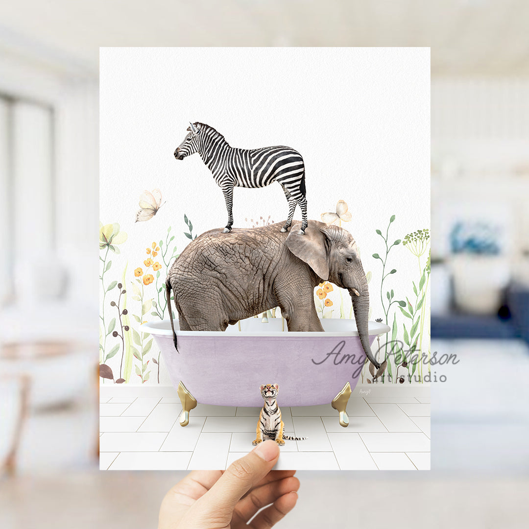 a person holding up a card with a picture of a zebra and an elephant in