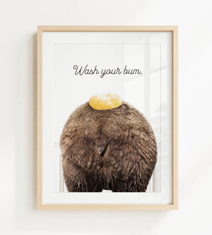 a picture of a bear with a yellow object on its head, accompanied by the text "Wash your butt."