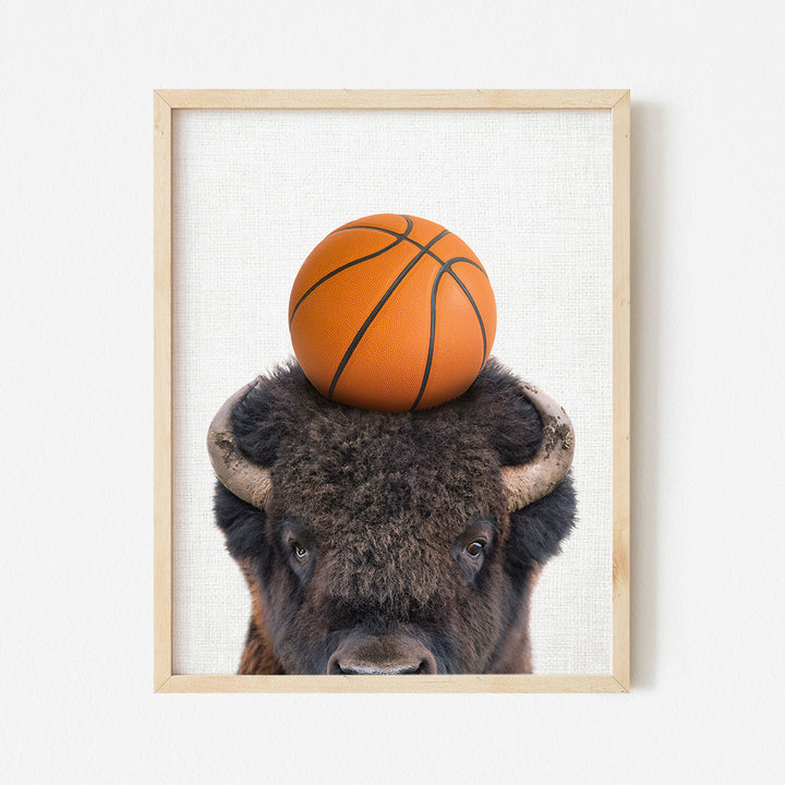 a bison with a basketball on its head