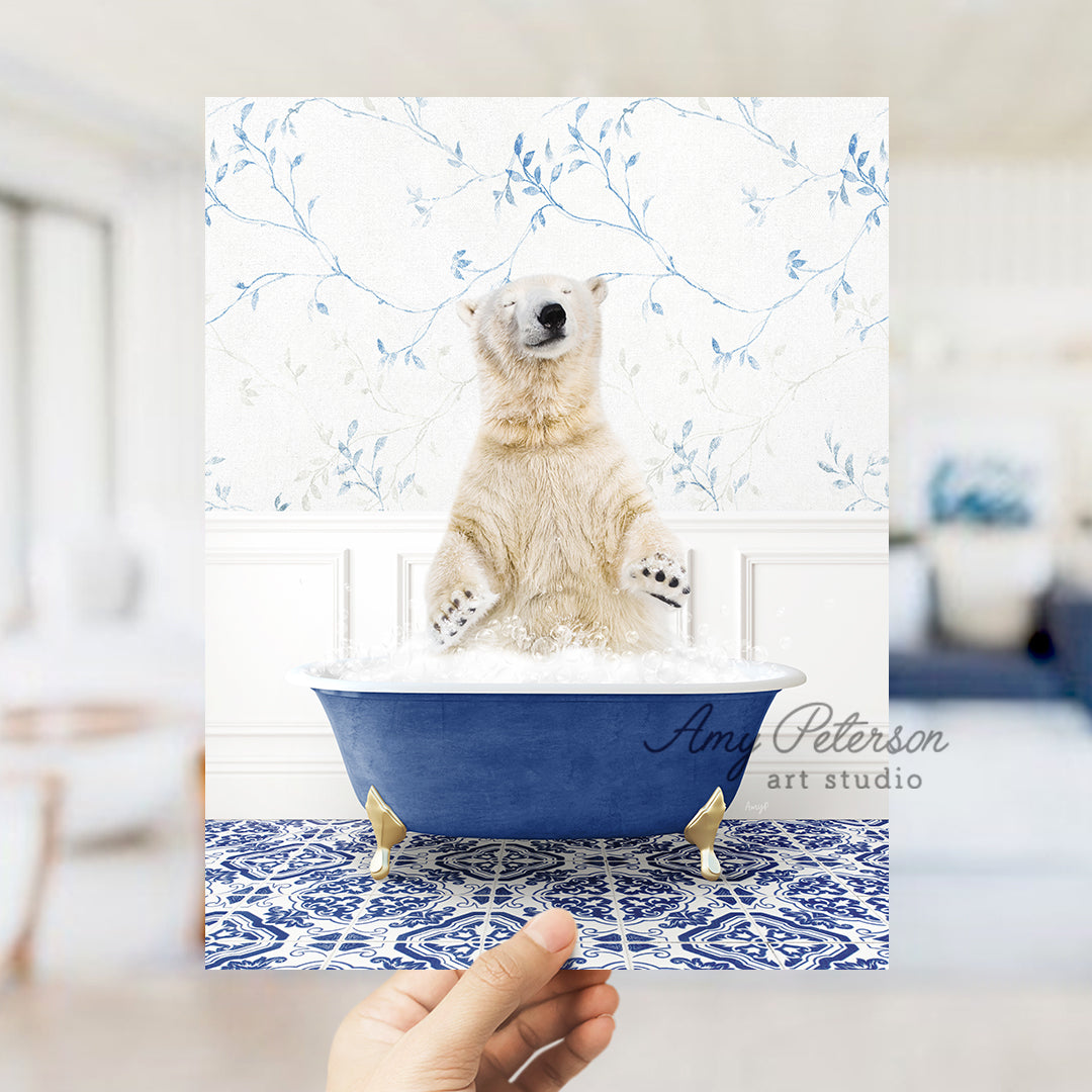 a polar bear sitting in a blue bath tub