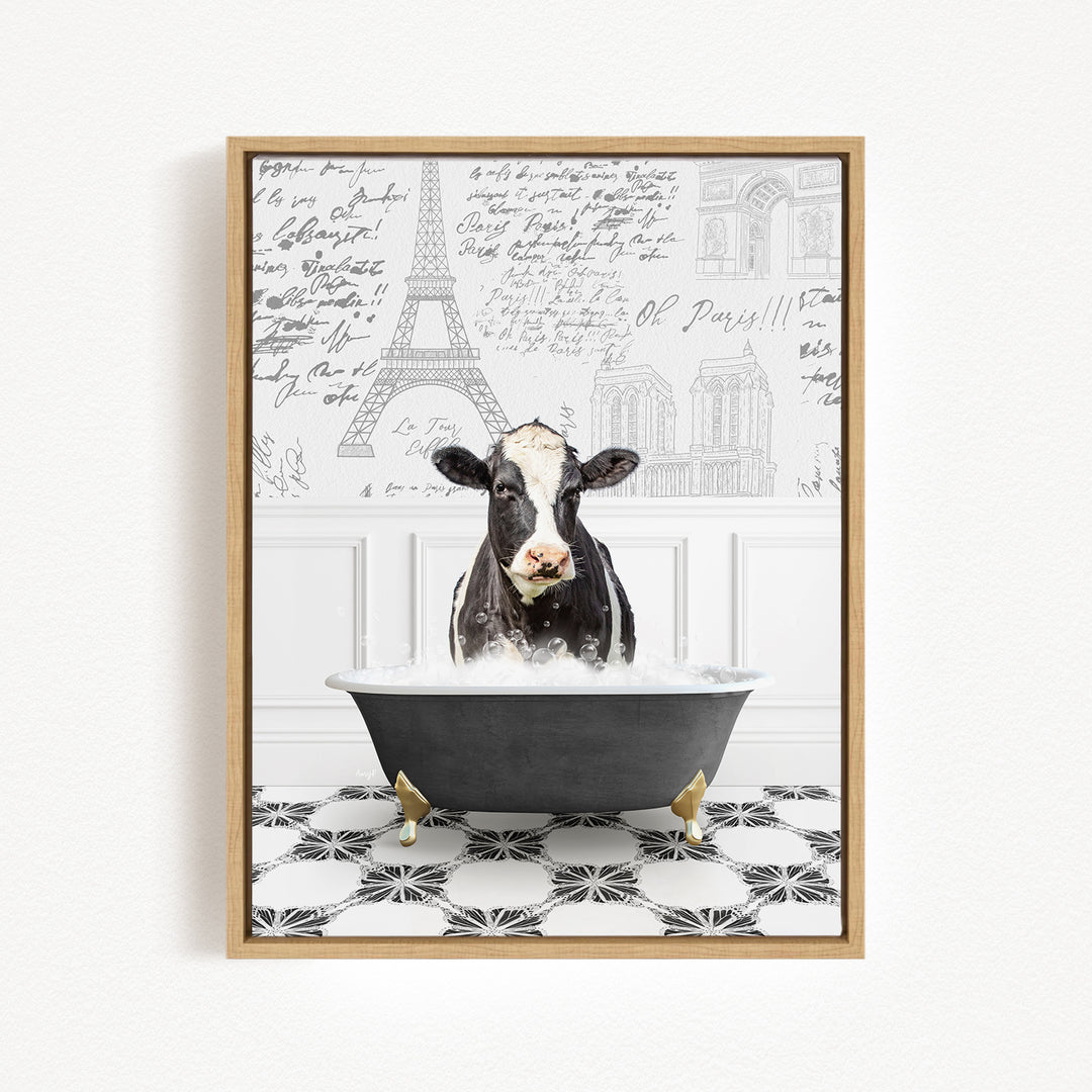 A black and white cow is sitting in a bathtub filled with water, surrounded by a black and white tiled floor and a wall with various inscriptions and drawings.