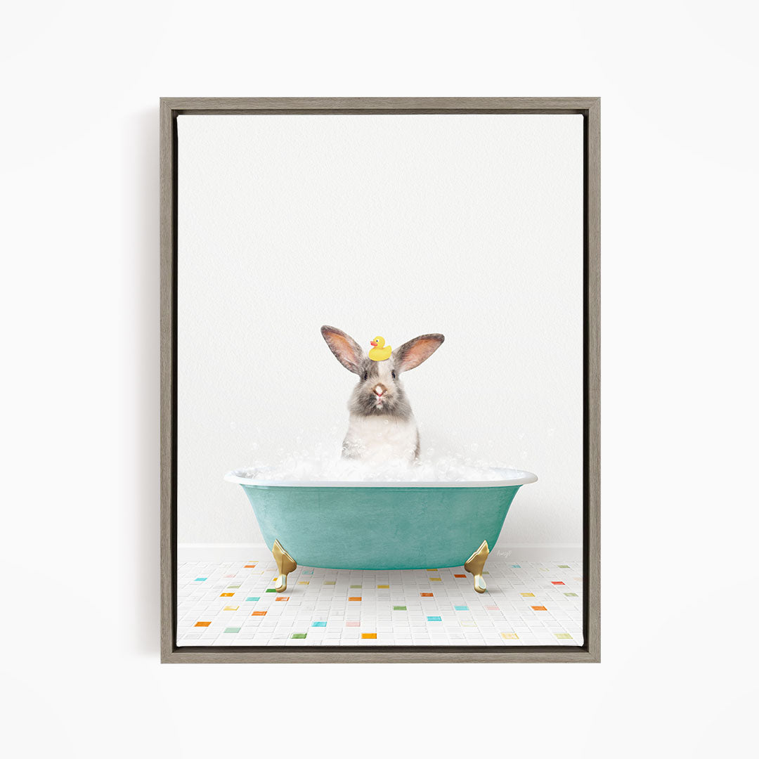 A cute rabbit sitting in a green bathtub filled with bubbles, with a yellow rubber duck floating on the water.