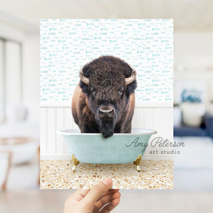 a bison is standing in a bathtub with his head sticking out