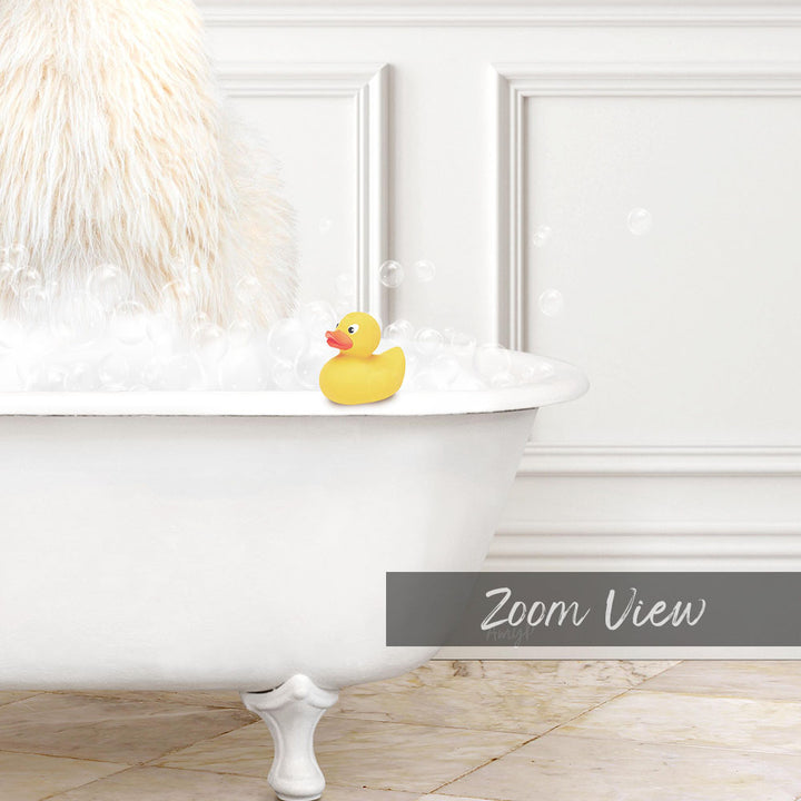 A white bathtub filled with bubbles, with a yellow rubber duck sitting on the edge.