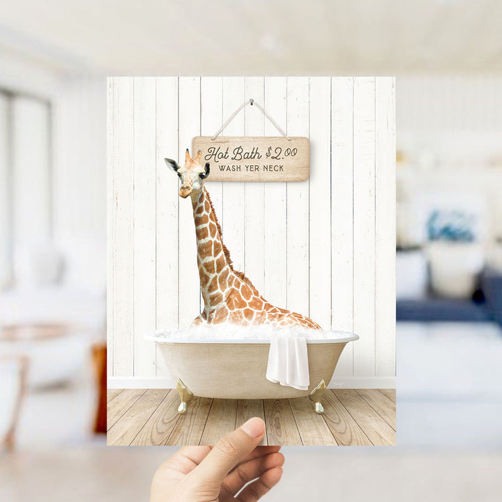 A giraffe sitting in a bathtub, with a sign above it that says "Hot Bath $2.00 WASH YOUR necks".