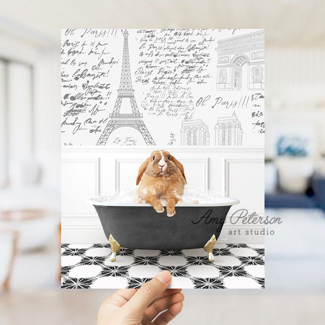 a person holding up a card with a picture of a rabbit in a bathtub