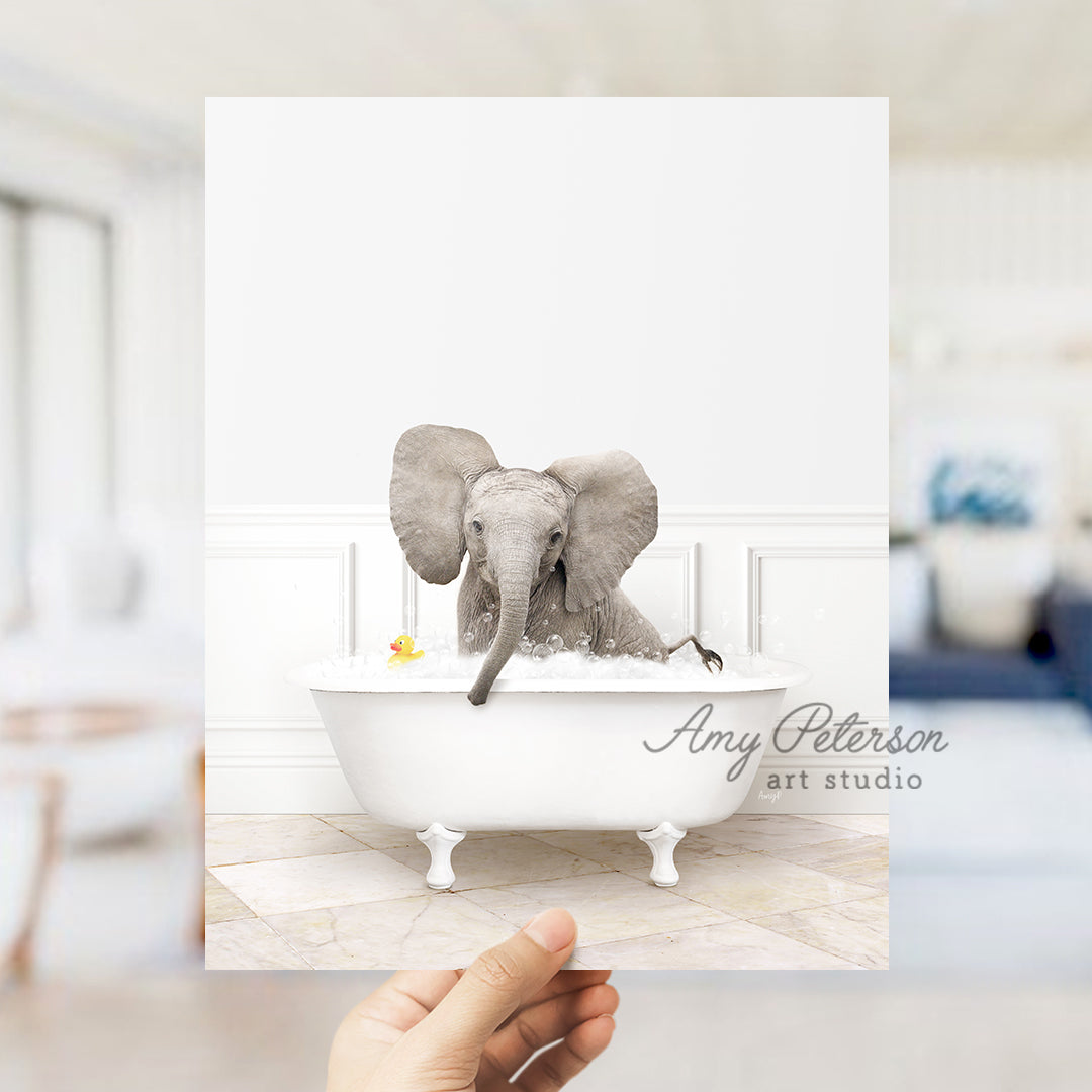 a person holding up a card with an elephant in a bathtub