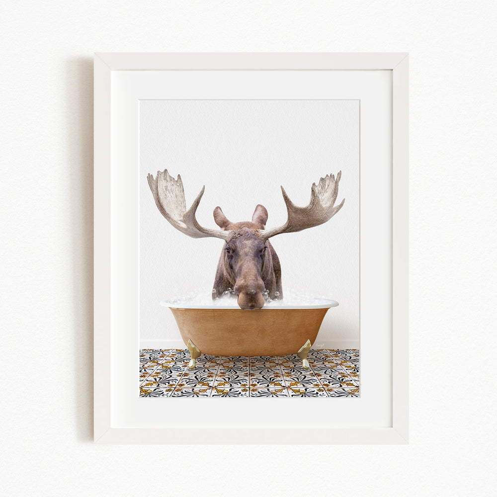 A moose with large antlers is sitting in a bathtub filled with water, creating a whimsical and humorous scene.