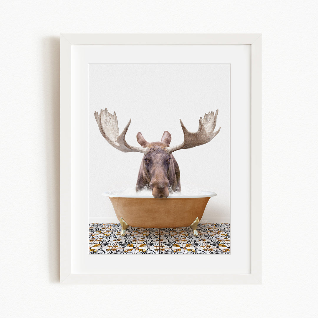 A moose with large antlers is sitting in a bathtub filled with water, creating a whimsical and humorous scene.