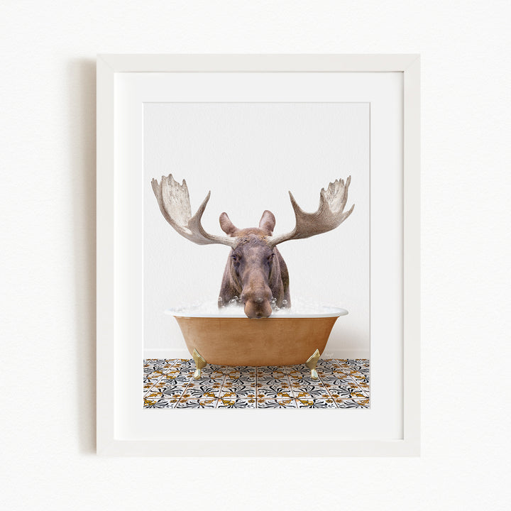 A moose with large antlers is sitting in a bathtub filled with water, creating a whimsical and humorous scene.