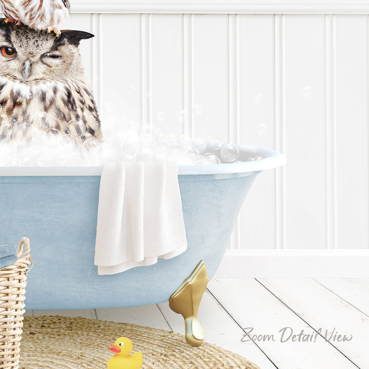 A large owl perched on the edge of a blue bathtub filled with bubbles, with a yellow rubber duck nearby.