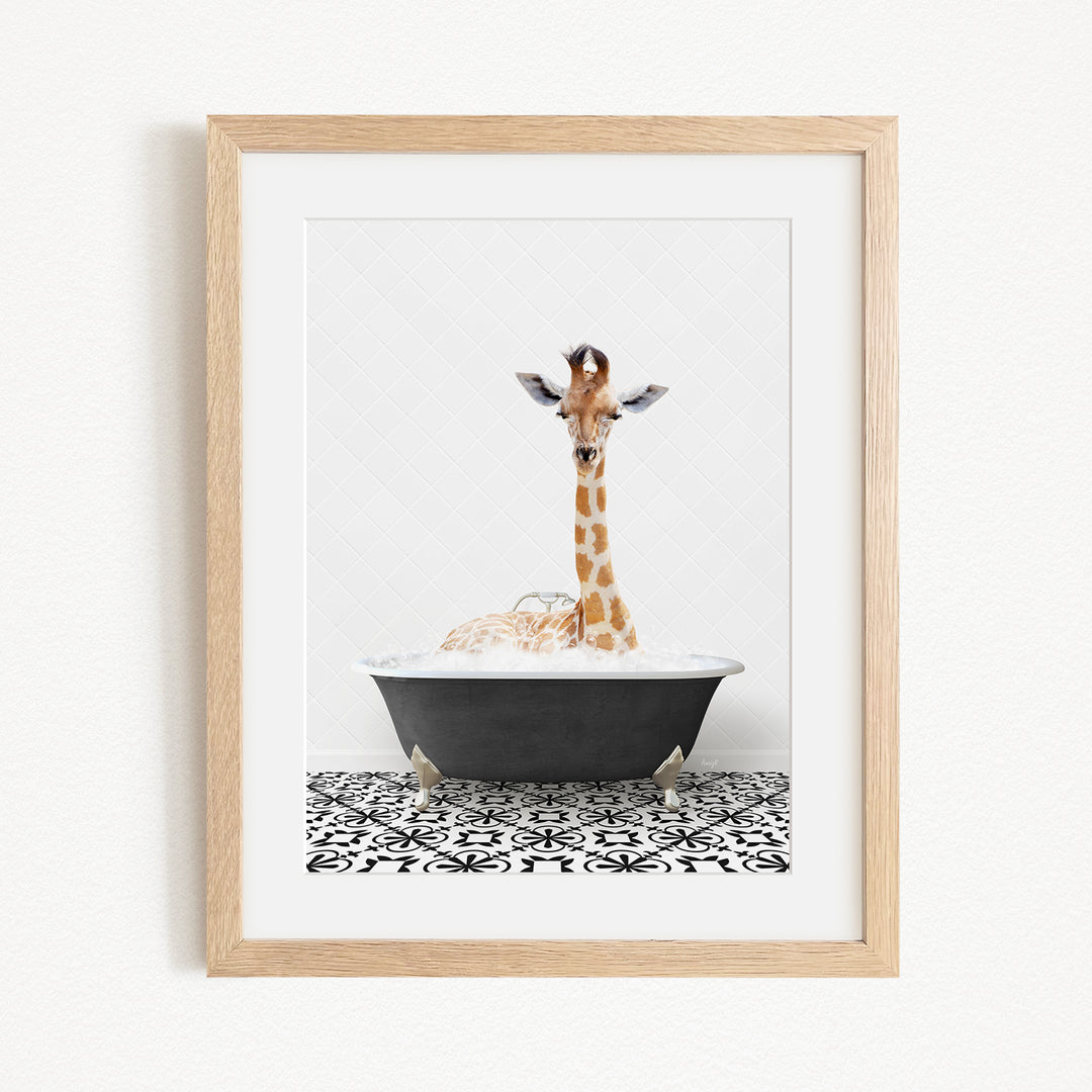 A giraffe is sitting in a bathtub filled with bubbles, creating a whimsical and playful scene.