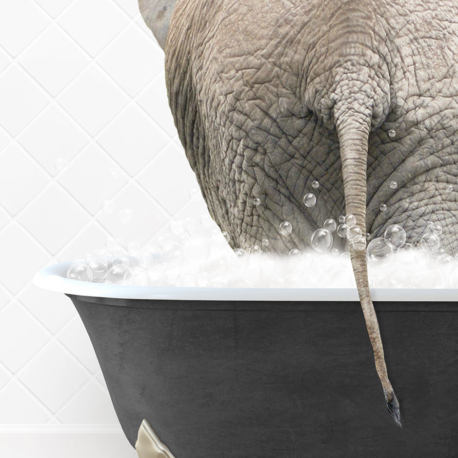 an elephant taking a bath in a bathtub