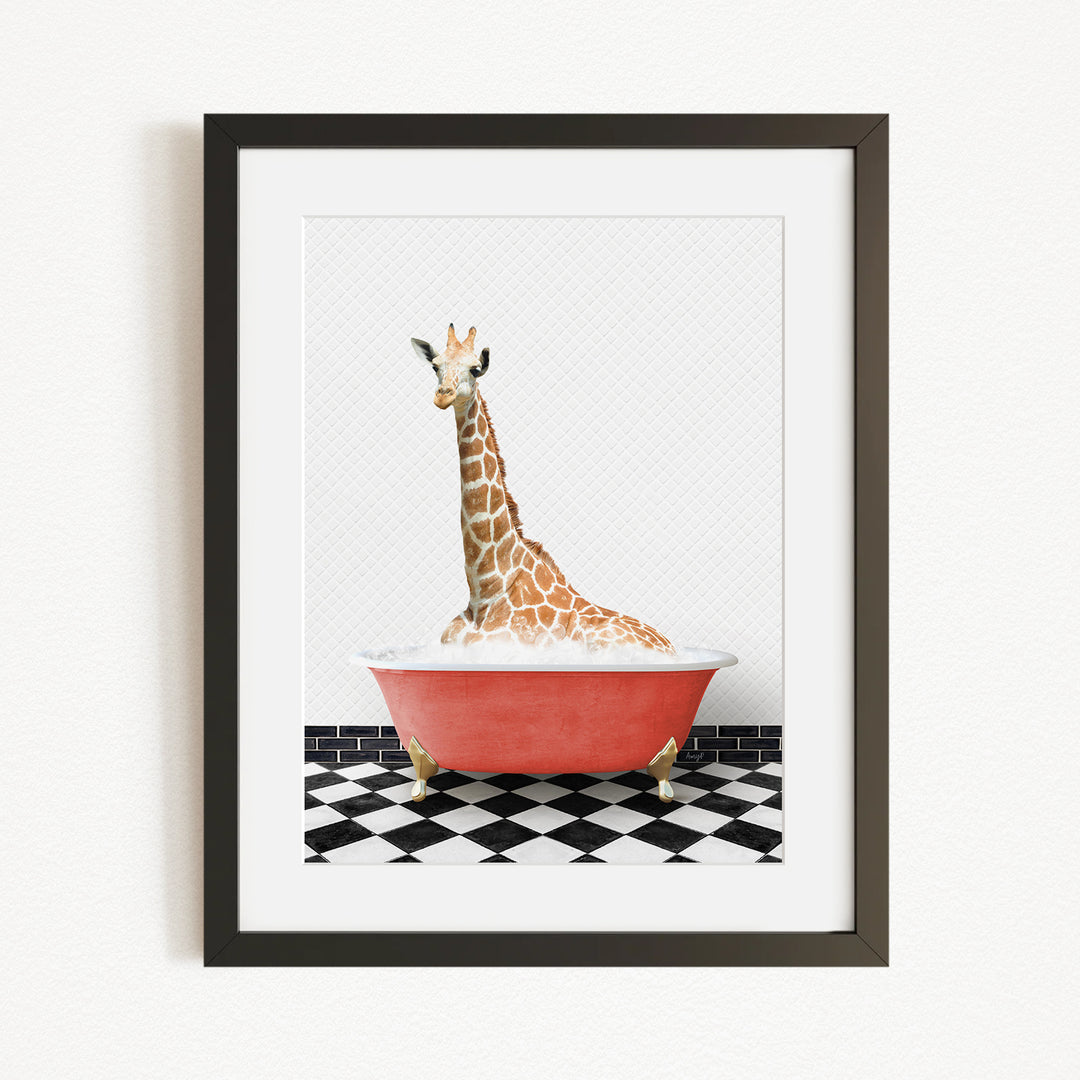 A giraffe sitting in a red bathtub on a black and white checkered floor.