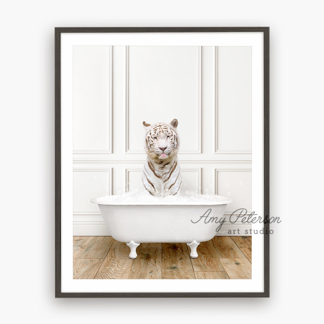 a white tiger is sitting in a bathtub